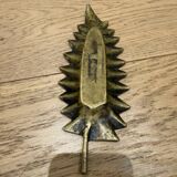 Brass pocket emptier