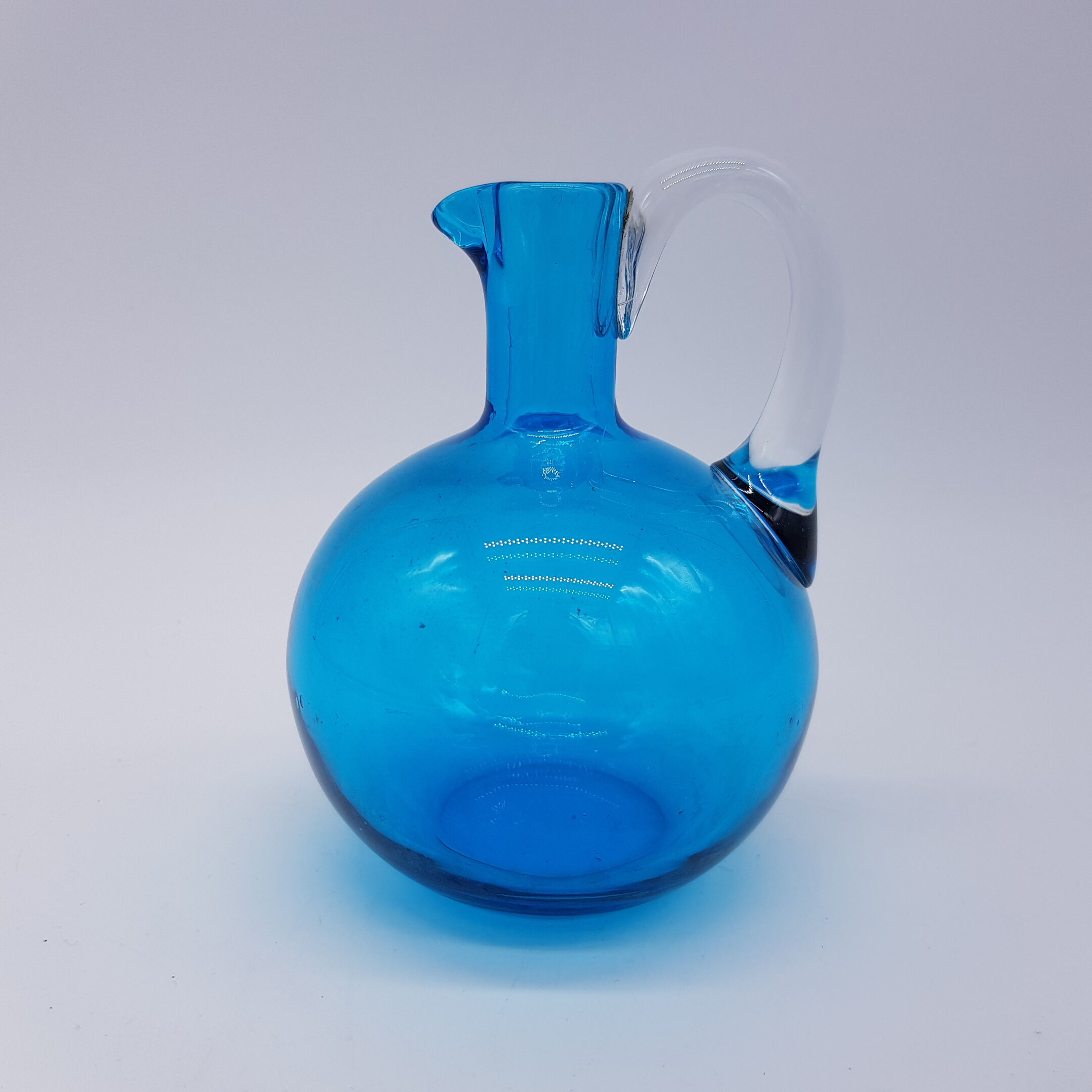 Blue blown glass pitcher