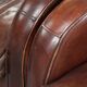 Dark cognac-coloured set of 2 sheepskin armchairs with a sleek design