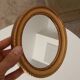 Small vintage oval mirror in gilded resin from the 60s/70s.