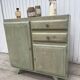 Compass leg sideboard