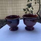 Set of 2 glazed terracotta footed bowls.