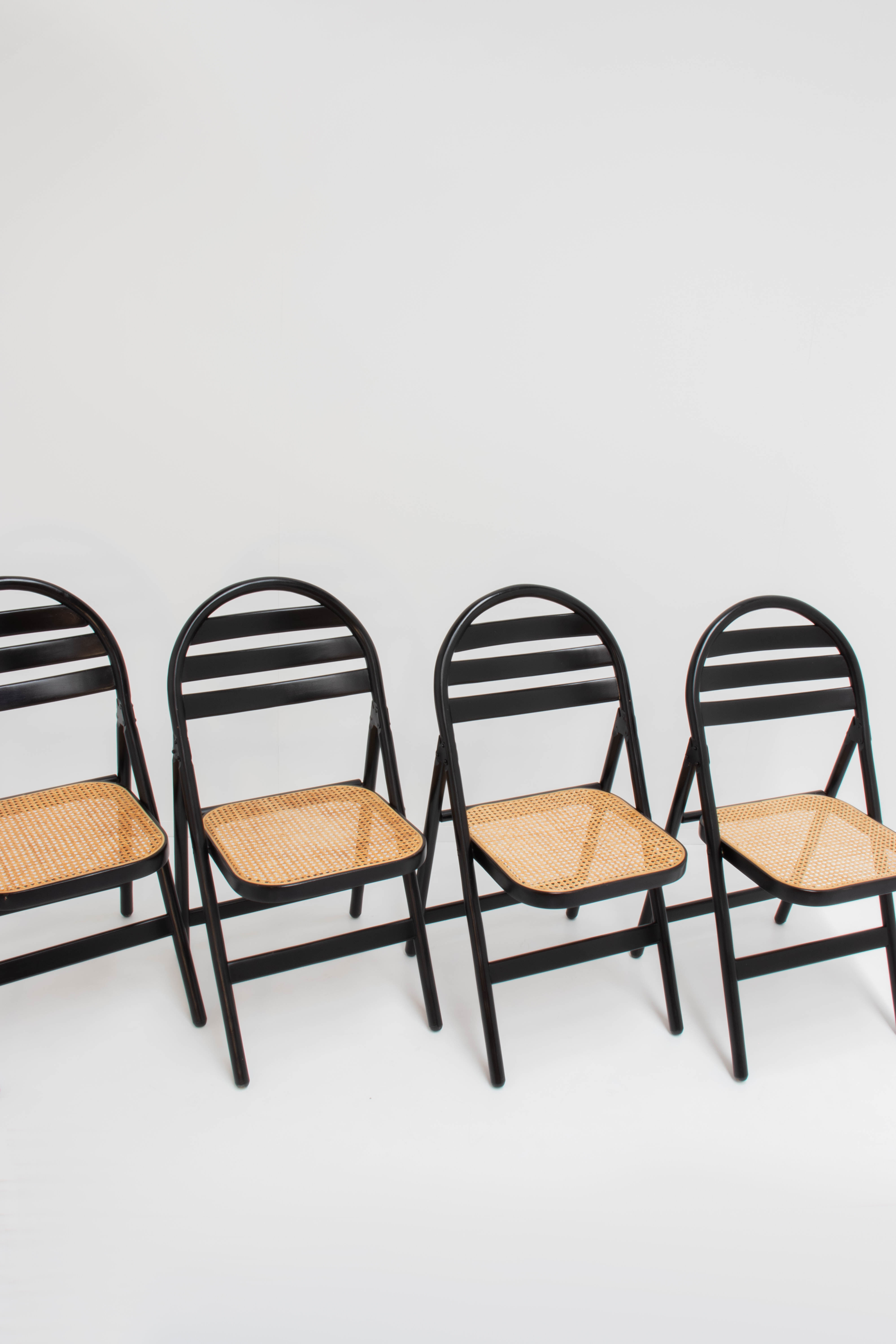 4 vintage wood folding chairs with cane seating