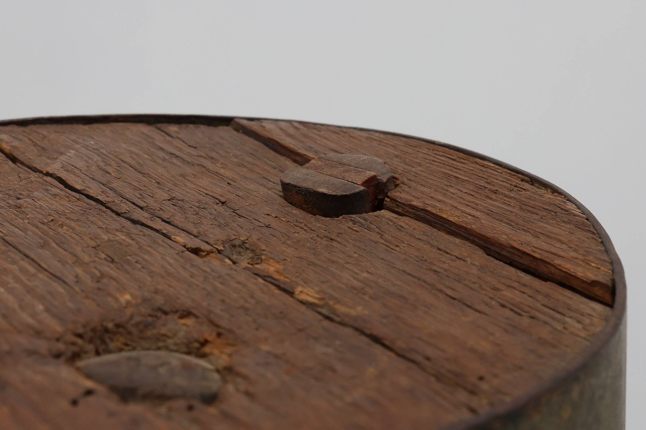 Brutalist French solid oak tripod stool with metal rim, 1850s
