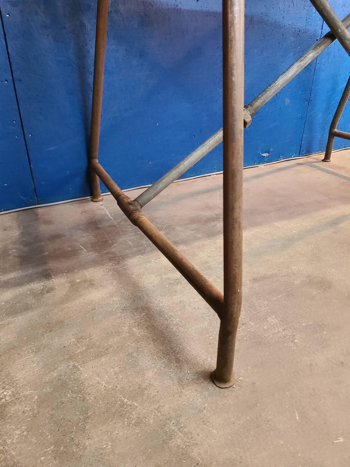 Vintage workbench circa 1930, folding metal leg.