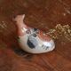 Ancient Mexican bird statue in ceramic