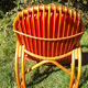 Fauteuil vintage rouge en rotin et skai rouge
