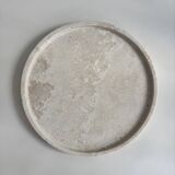 Circular flat travertine pocket emptier