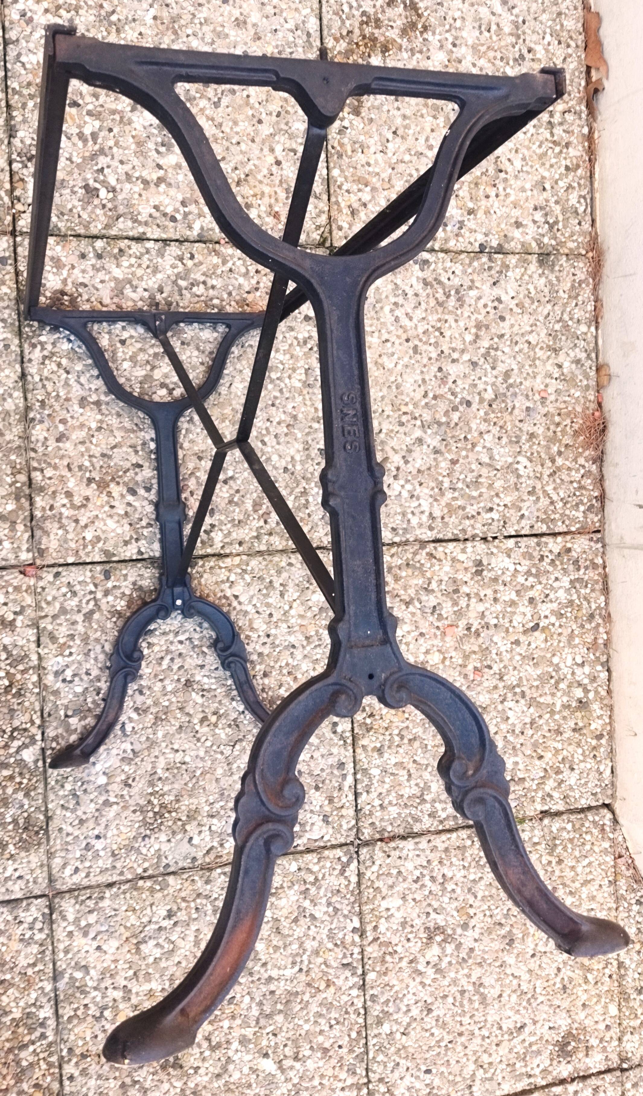 White marble table, cast iron base signed SNES, made in France