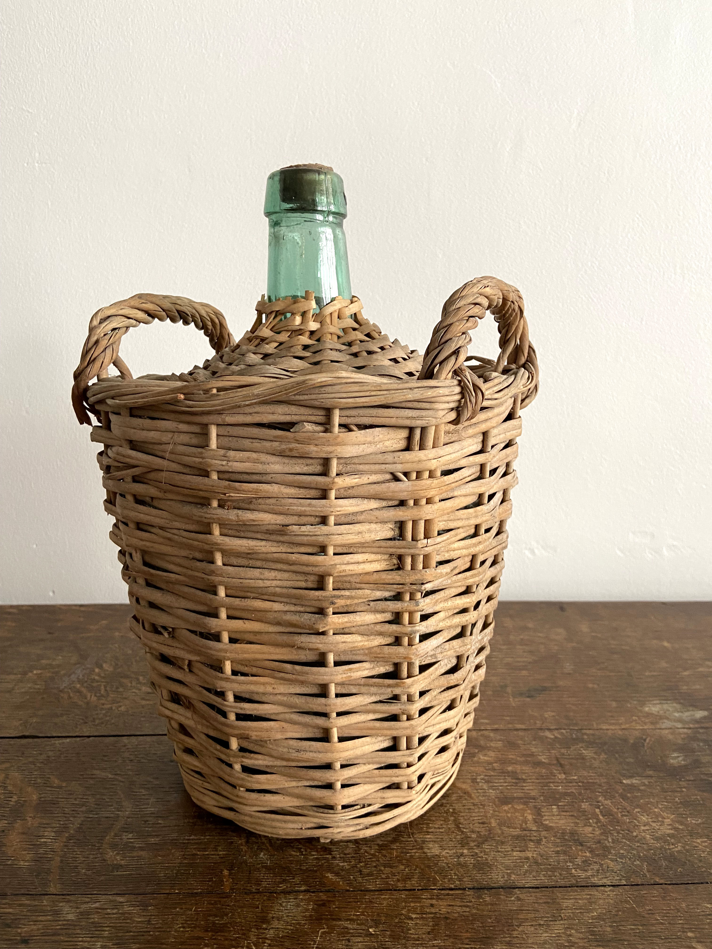 Demijohn surrounded by wicker
