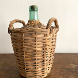 Demijohn surrounded by wicker