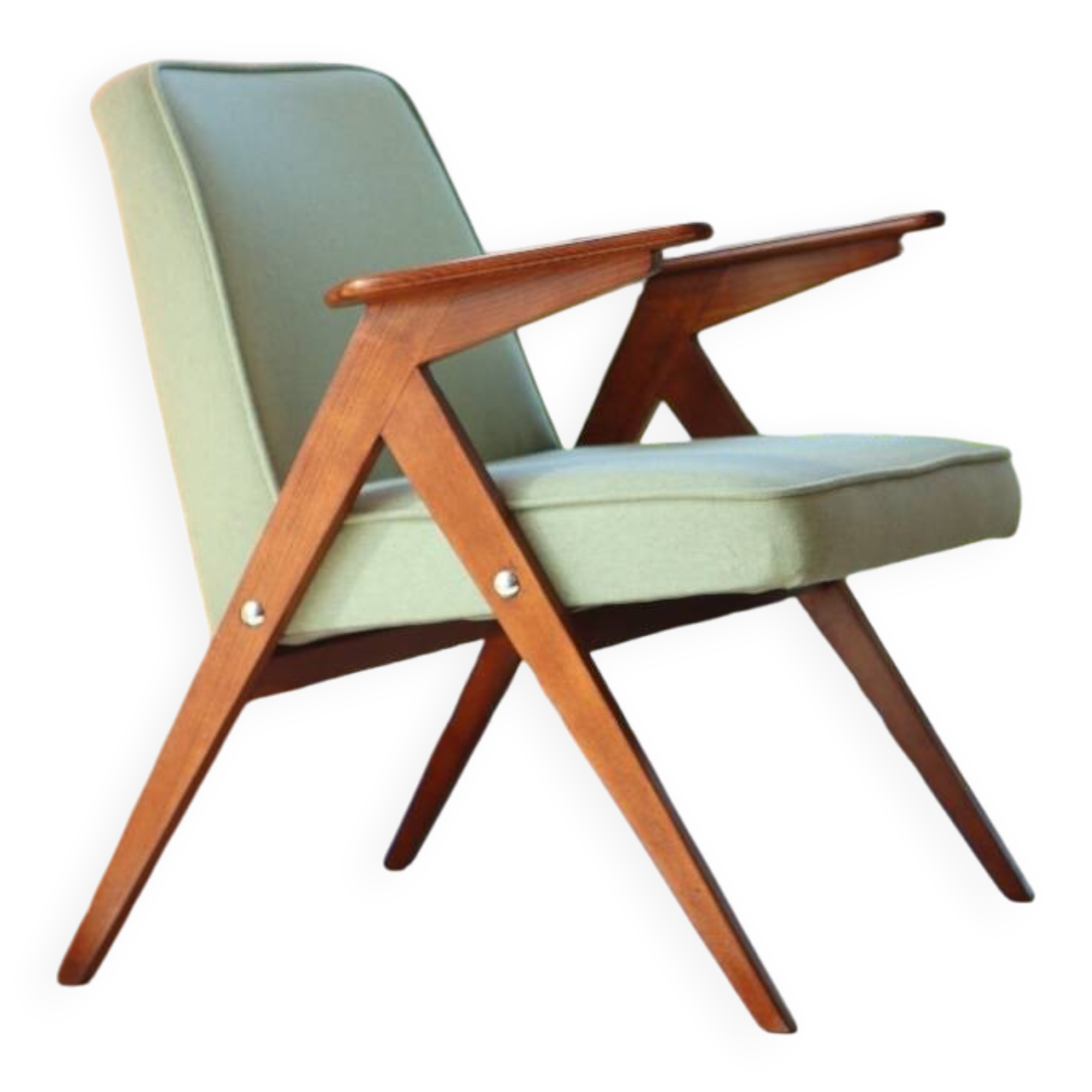 Vintage armchair in mint green wool, mid-century modern design.