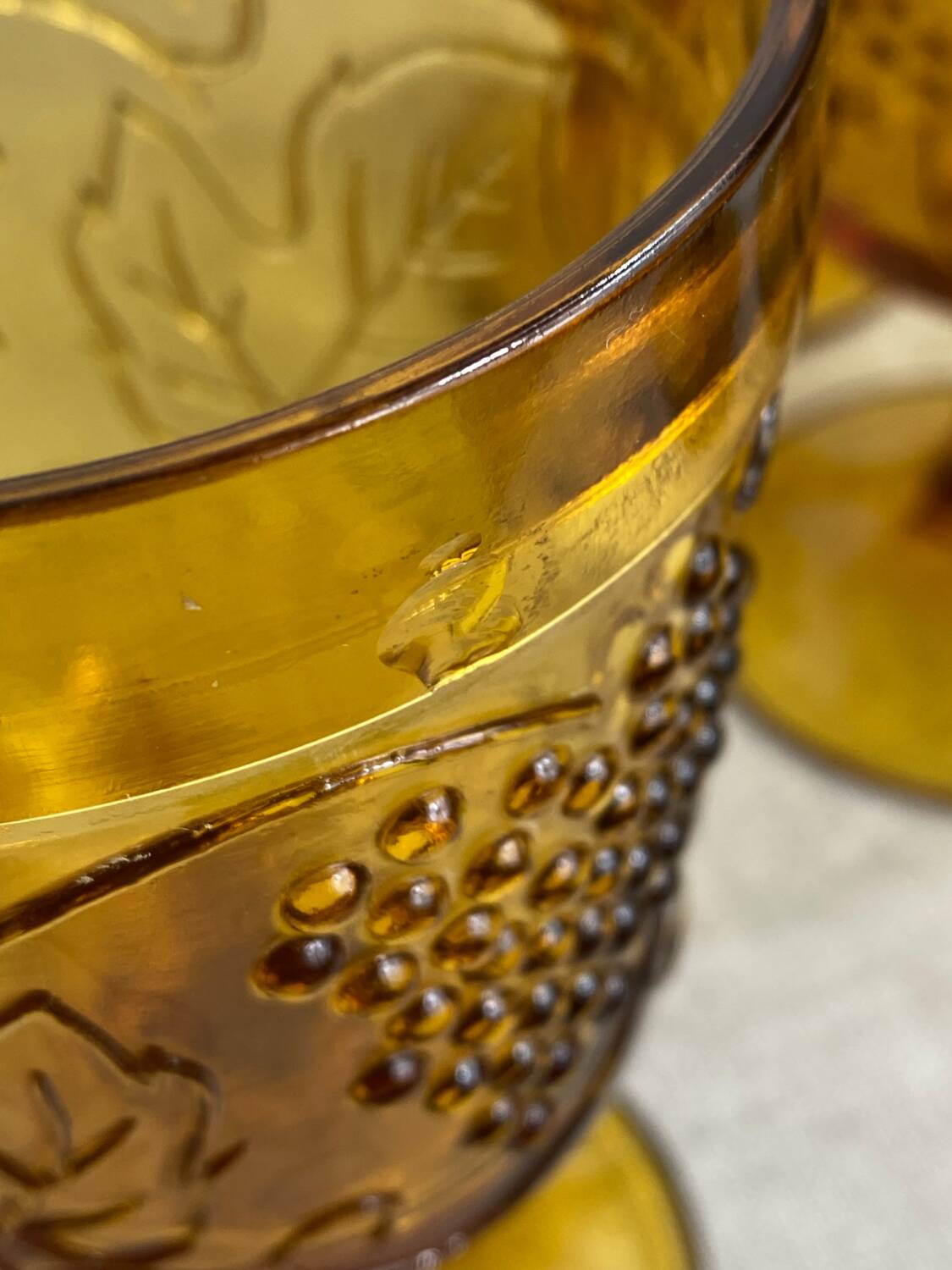 Six stemmed glasses in amber-colored molded glass