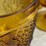 Six stemmed glasses in amber-colored molded glass