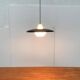 Minimalist metal and glass pendant lamp in mid-century style.