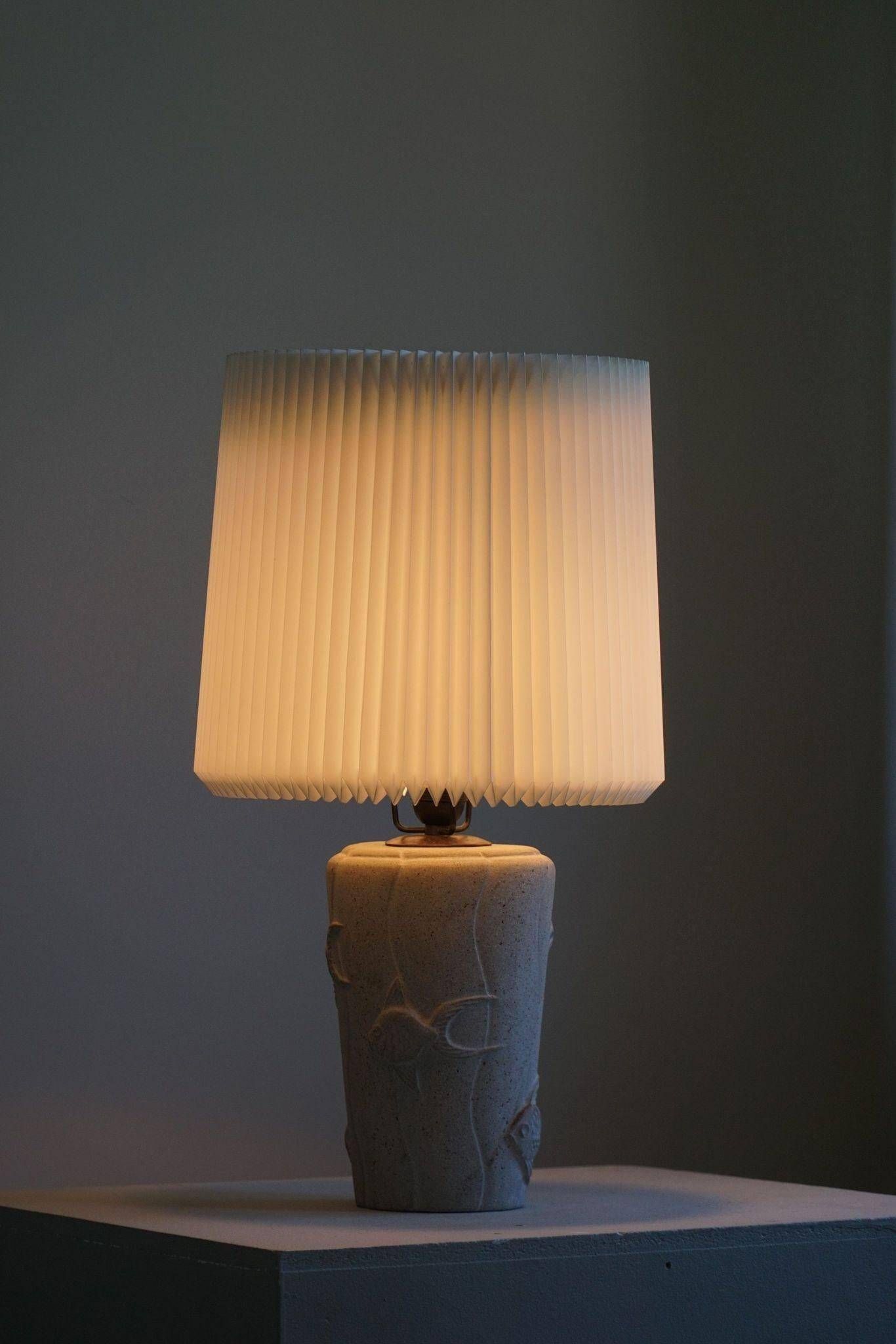 Modern vintage French table lamp, made of stone with fish patterns, 1970s.