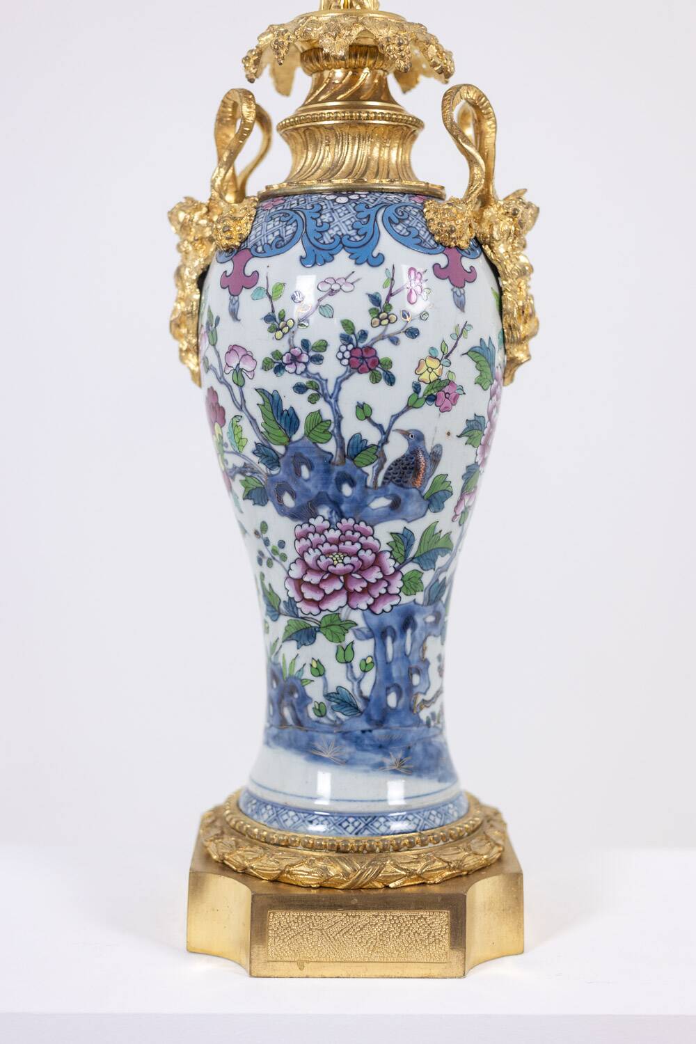 Pair of porcelain lamps decorated with bronze satyrs. Circa 1880.