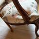 Louis XV style armchair upholstered in floral fabric.