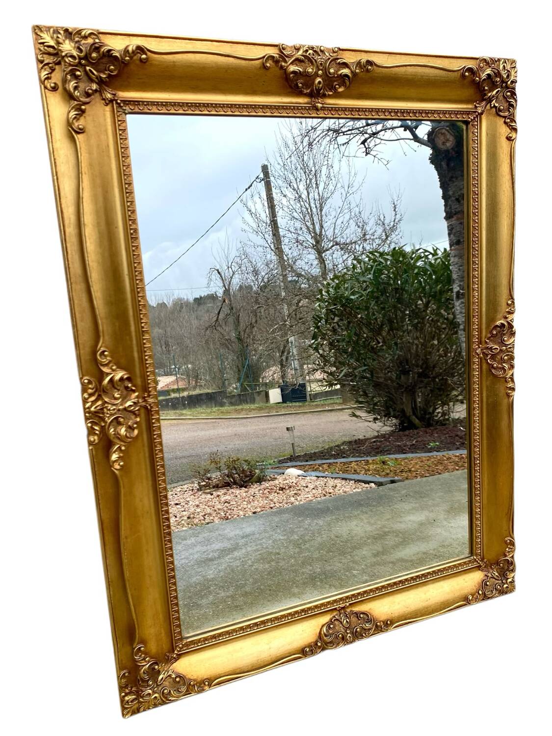 Miroir biseauté en bois doré
