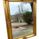Miroir biseauté en bois doré