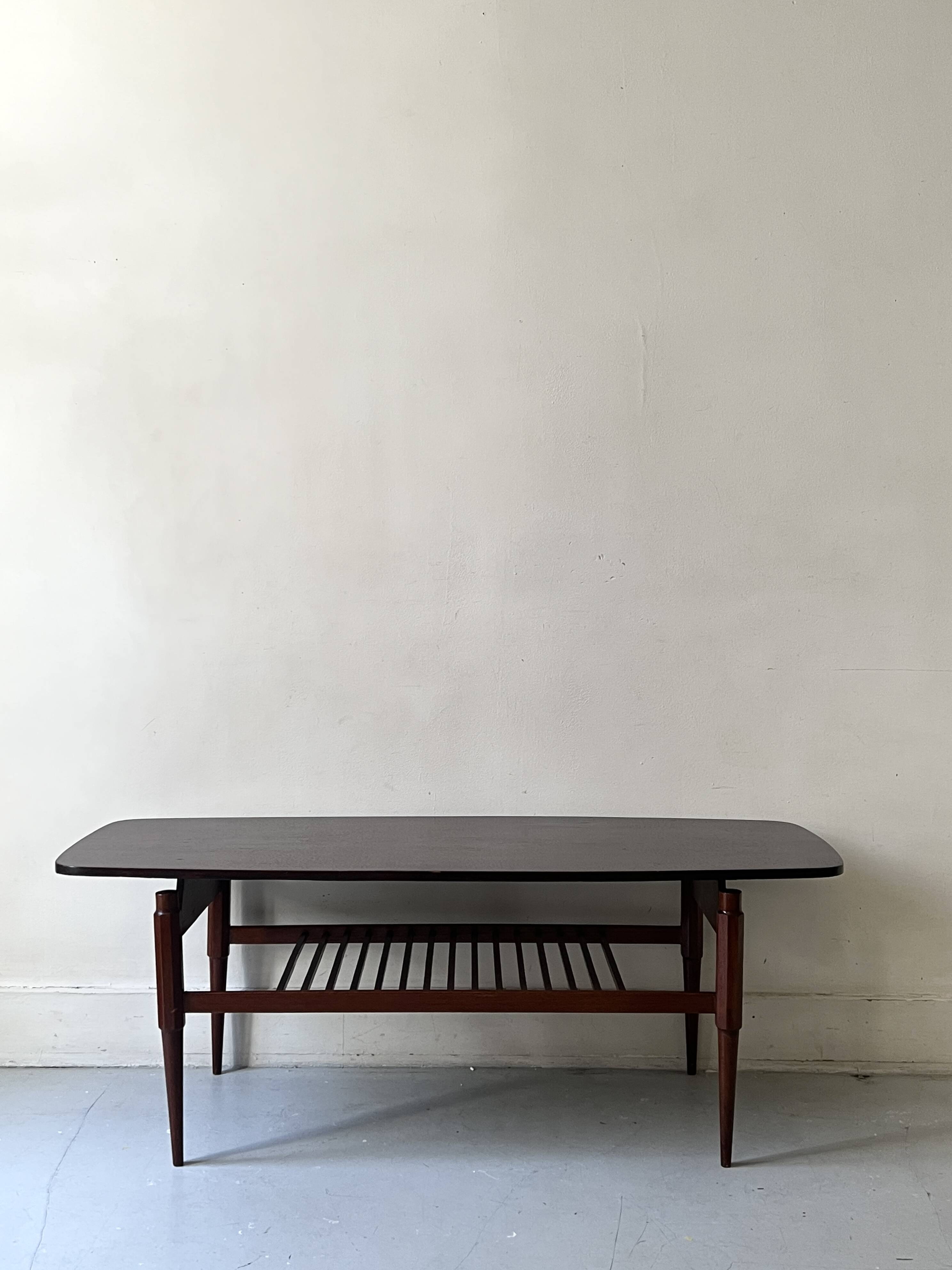 Danish teak coffee table with a double top, 1950s design.