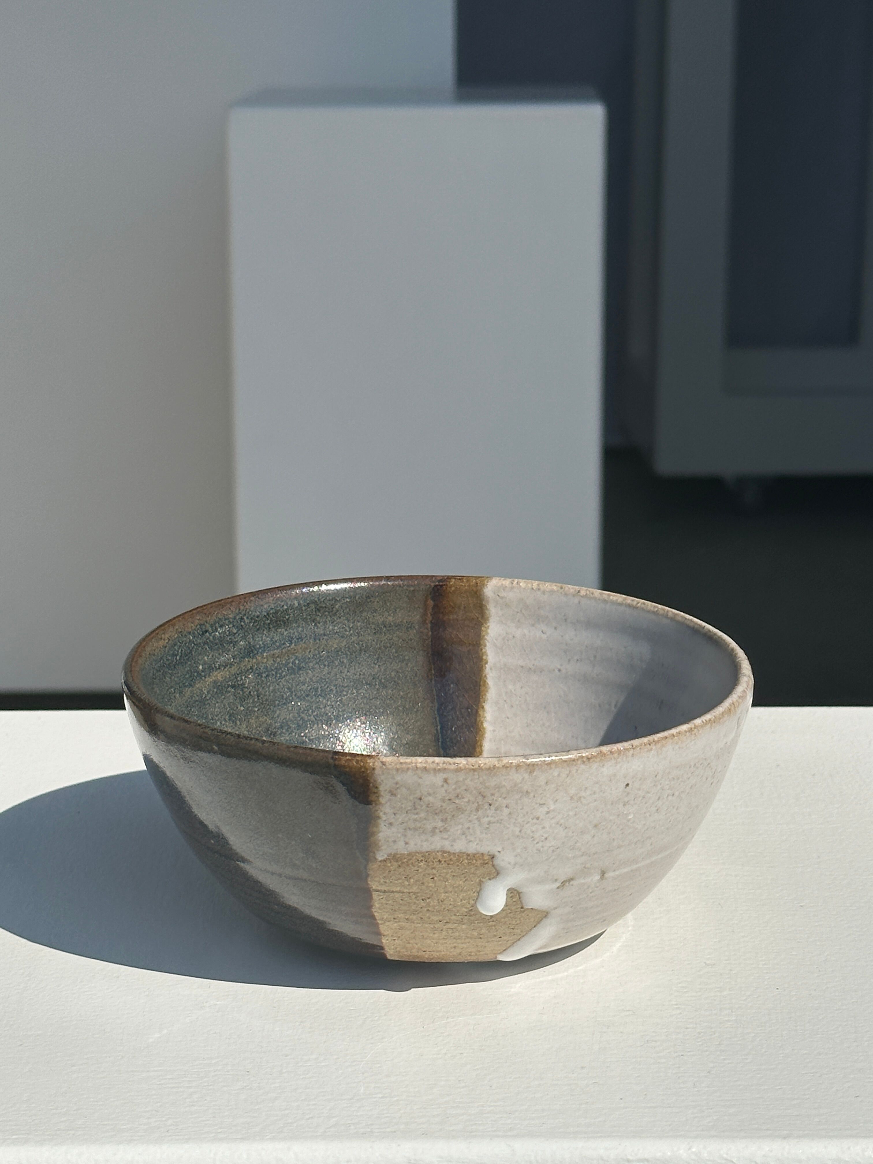 White and glossy brown two-tone ceramic bowl, matt earth