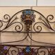 Venetian bed in iron and cast iron from the Art Nouveau period with polychrome decorations