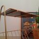 Pedestal table, door magazines in gilded metal years 50 - 60