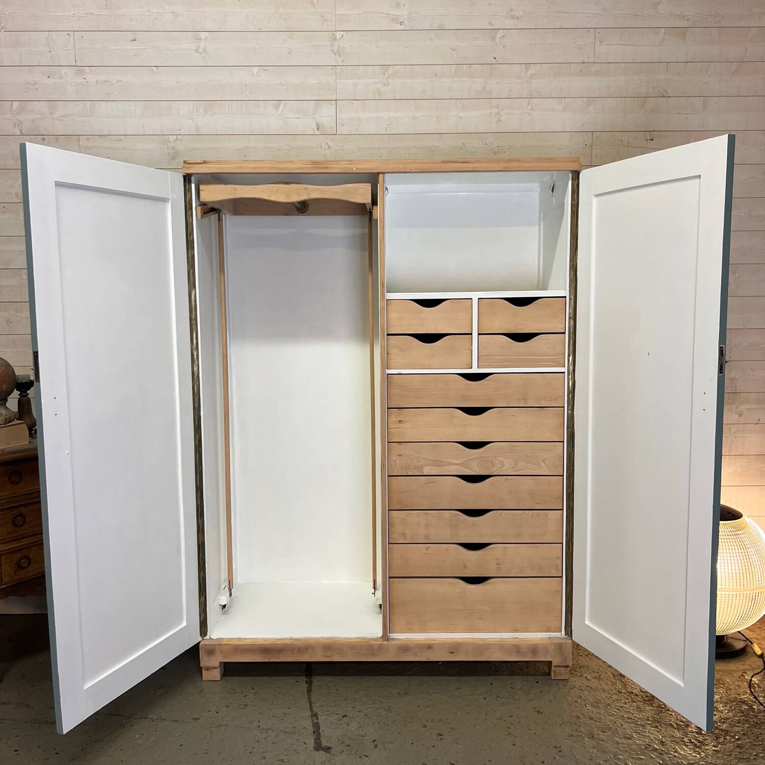 Wardrobe with two wardrobe compartments and drawers