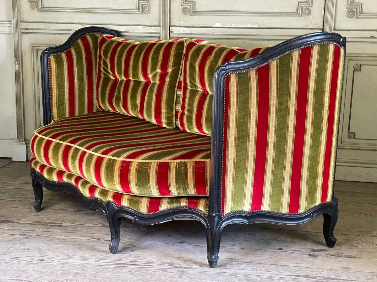 Louis XV style sofa in carved wood with a black patina