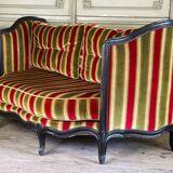 Louis XV style sofa in carved wood with a black patina