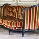 Louis XV style sofa in carved wood with a black patina