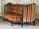 Canapé Louis XV en bois sculpté patine noire