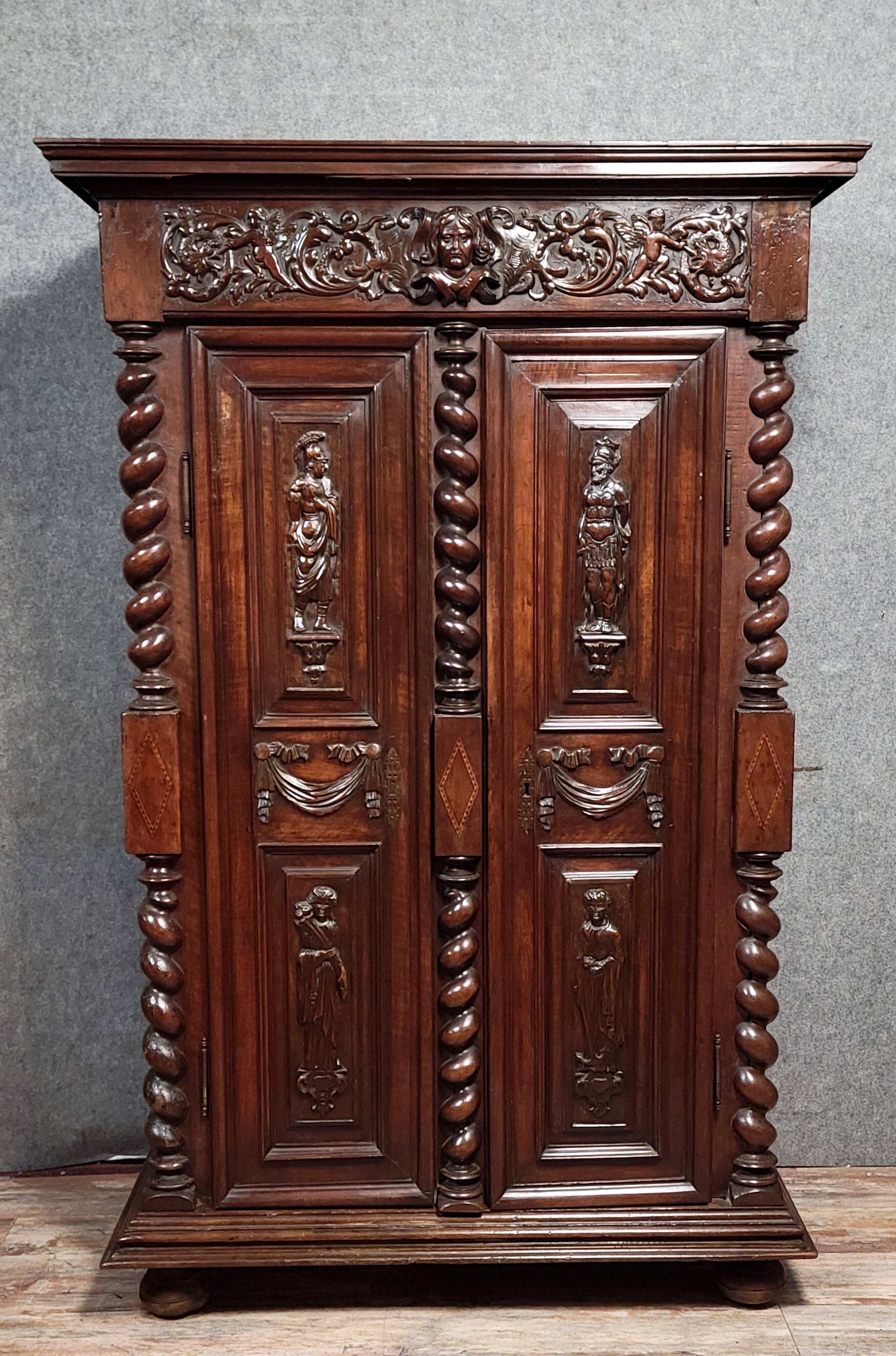 Renaissance style wardrobe in richly carved solid wood, 17th century
