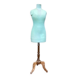 Old mannequin on wooden and fabric stand