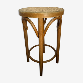 Curved wooden stool and cannage