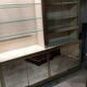 Ivory-colored and matte gold anodized aluminum display bookcase