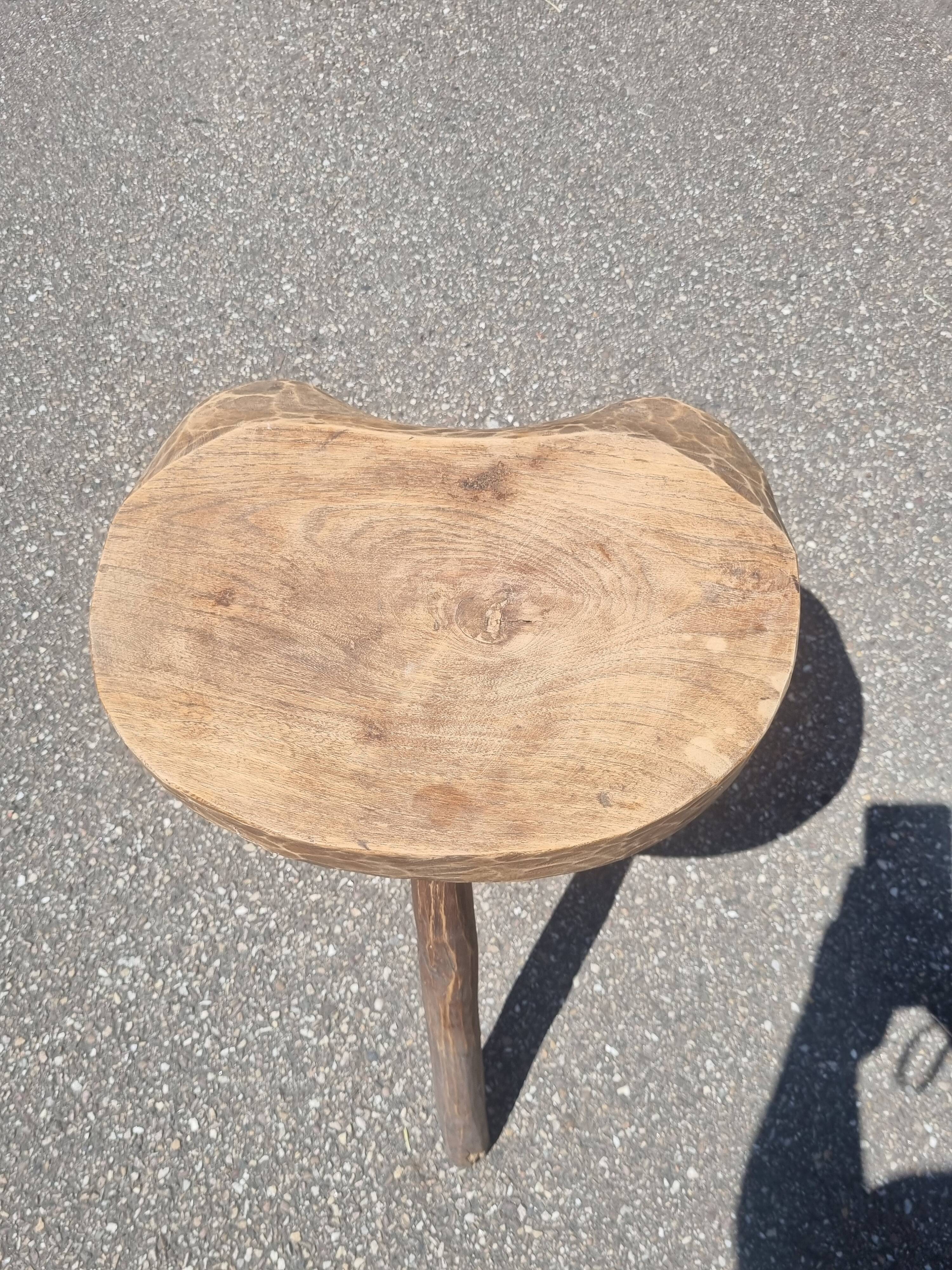 Old wooden tripod stool