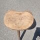 Old wooden tripod stool