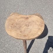 Old wooden tripod stool