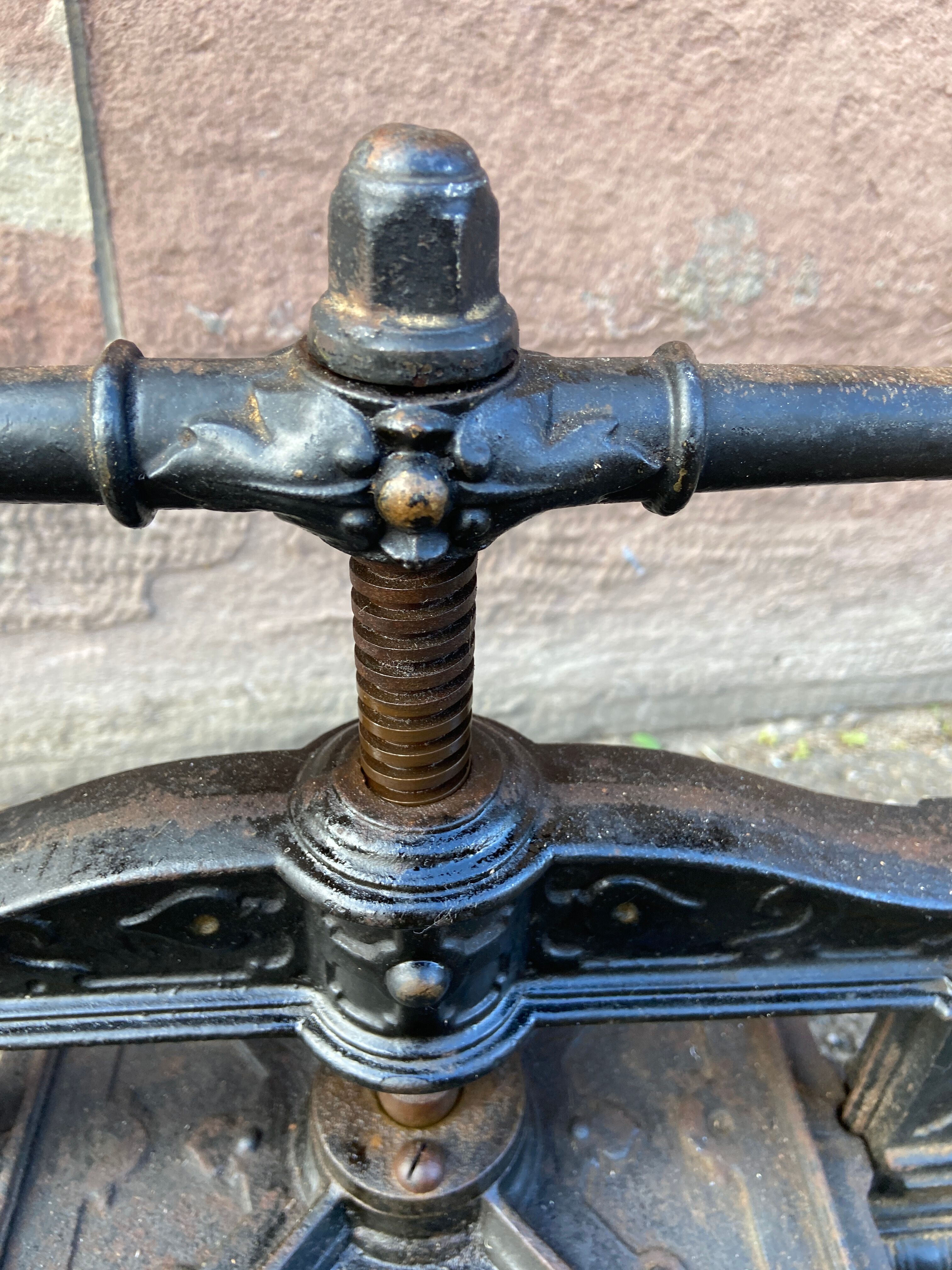 Old printing press in very old cast iron