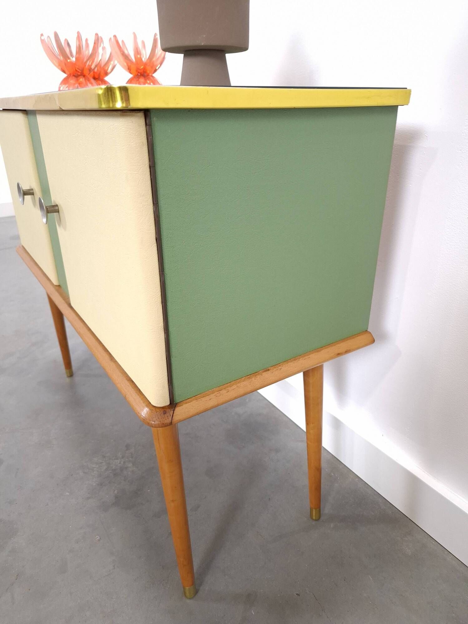 Vintage green DDR cabinet, model Libelle with glass top, slanted legs.