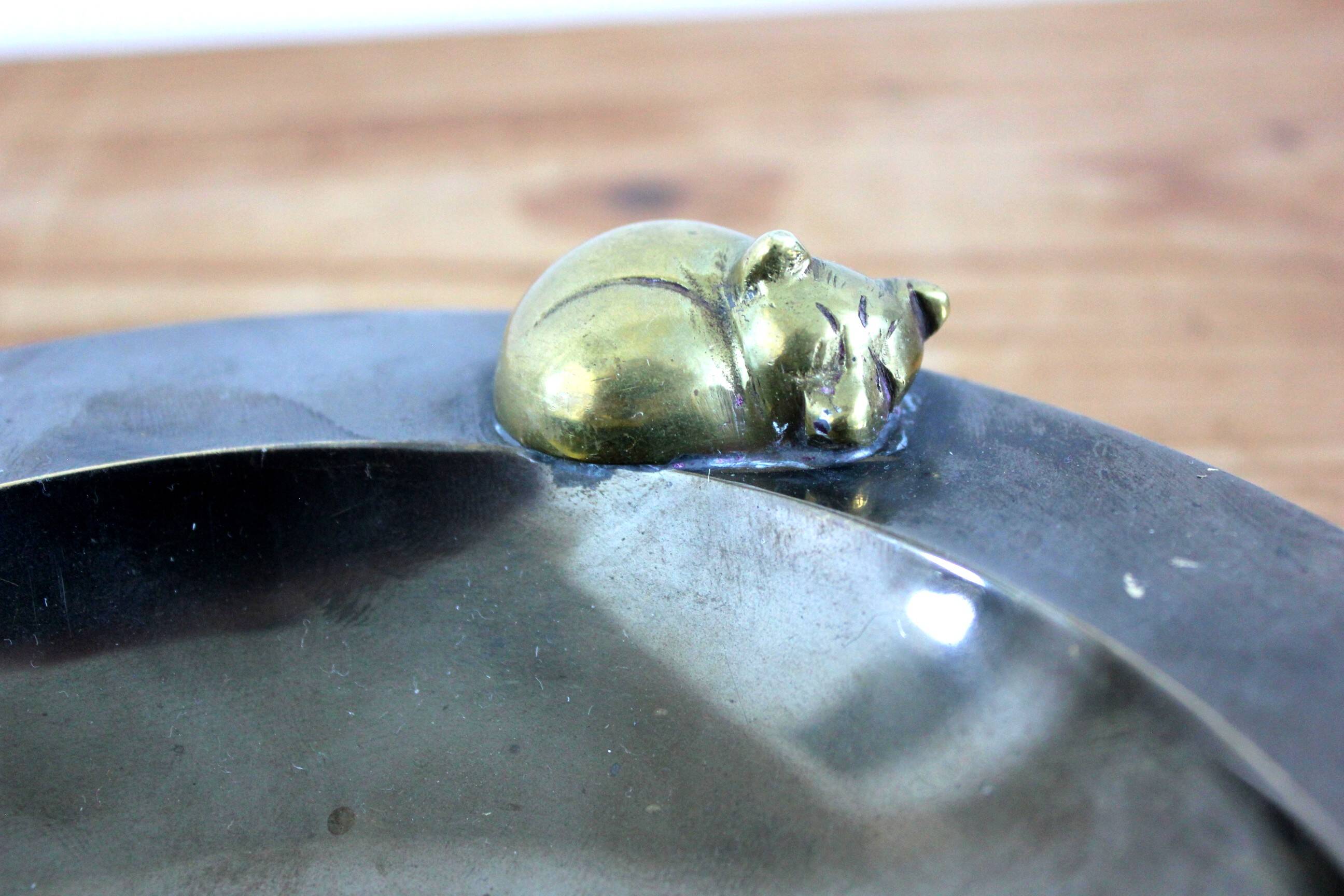 2 antique round serving trays with bronze handles and chrome finish.