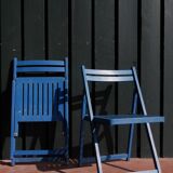 Set of two blue folding chairs