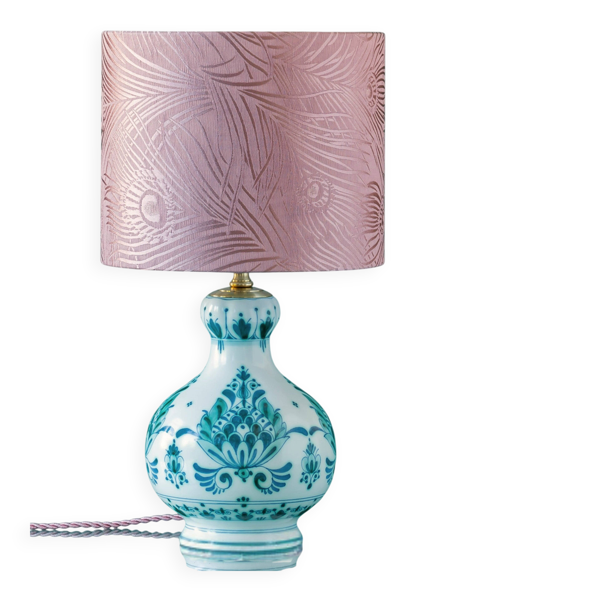 Royal Delft blue-green ceramic table lamp with pink jacquard peacock shade.