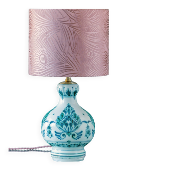 Royal Delft blue-green ceramic table lamp with pink jacquard peacock shade.