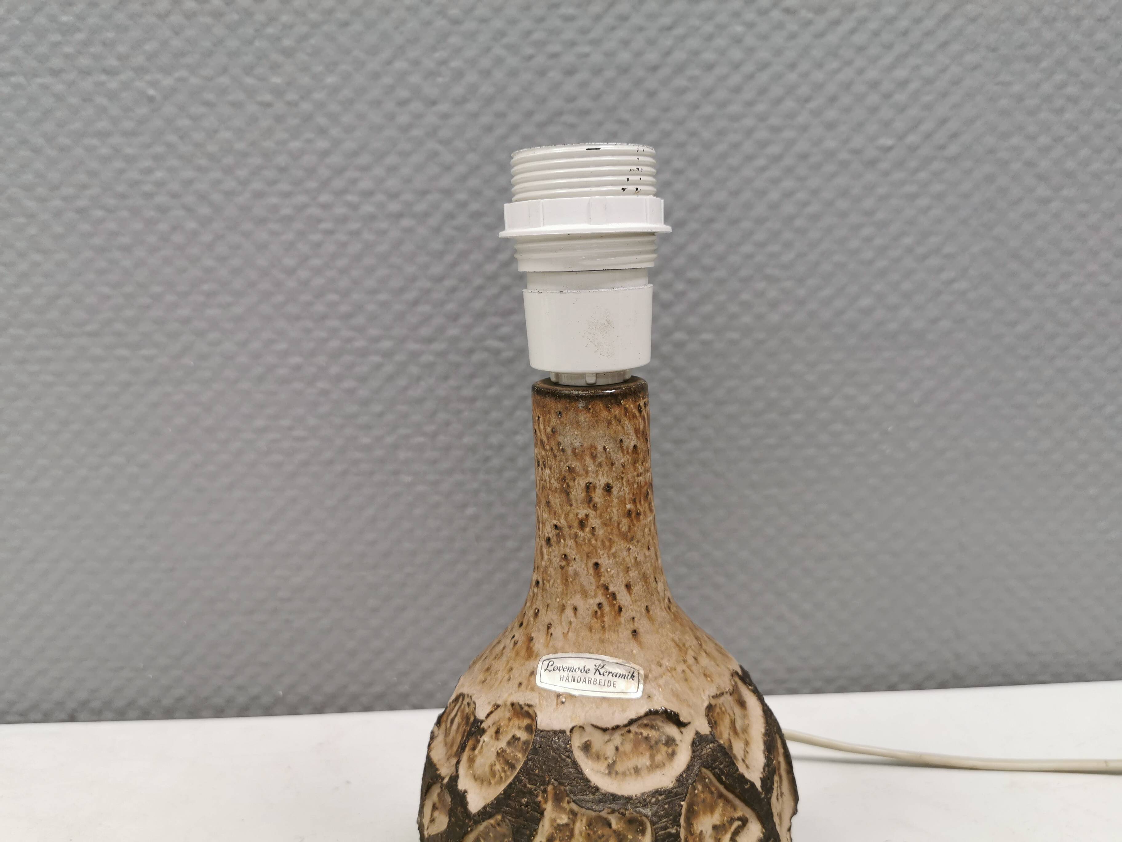 Small beautiful ceramic table lamp in earth colors.