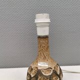 Small beautiful ceramic table lamp in earth colors.