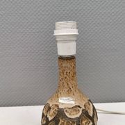 Small beautiful ceramic table lamp in earth colors.