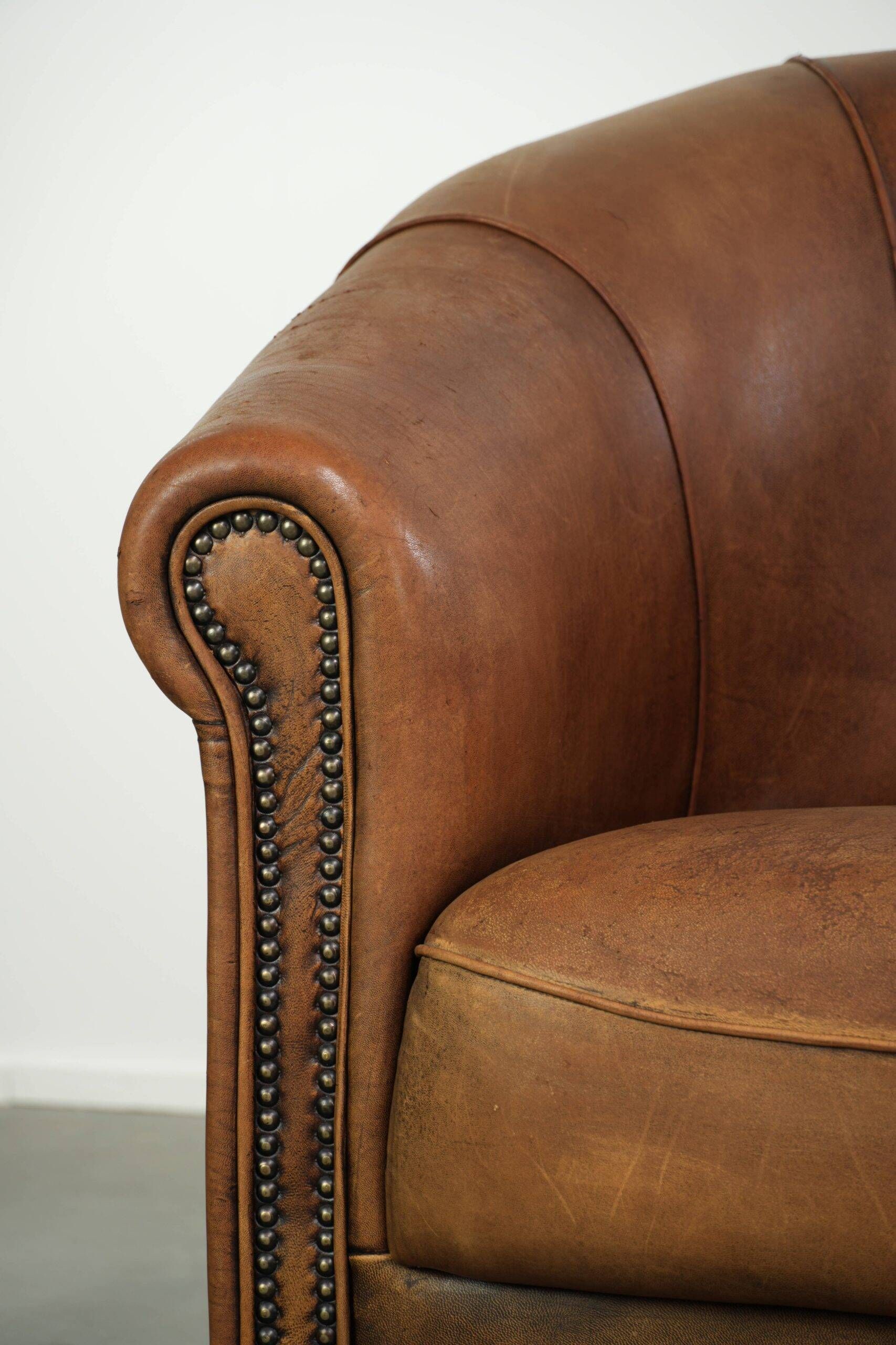 Sturdy set of vintage sheepskin club armchairs with a great appearance
